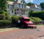 Woman Taken To Hospital After Truck Goes Over Wall