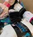 Local Group Donates Socks To Catholic Charities