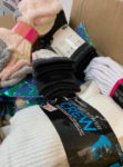 Local Group Donates Socks To Catholic Charities